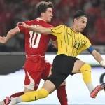 Kapten Timnas Malaysia Dion Cools saat memimpin tim di lapangan